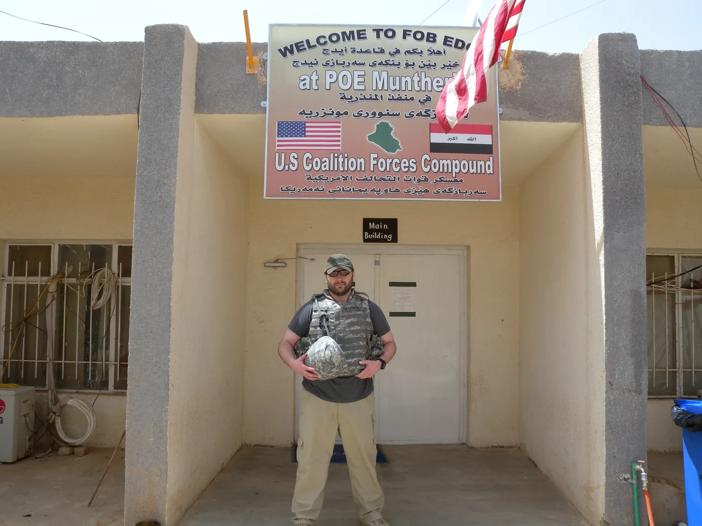 Jason Russell in Iraq at a U.S. Coalition Forces compound, wearing a DOD Biometrics plate carrier