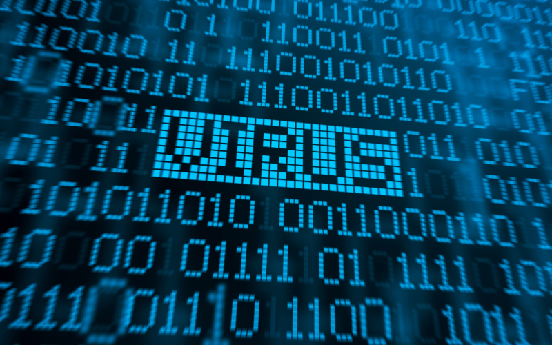 The word "VIRUS" appears in digital text among binary code, representing a computer virus or cybersecurity threat.