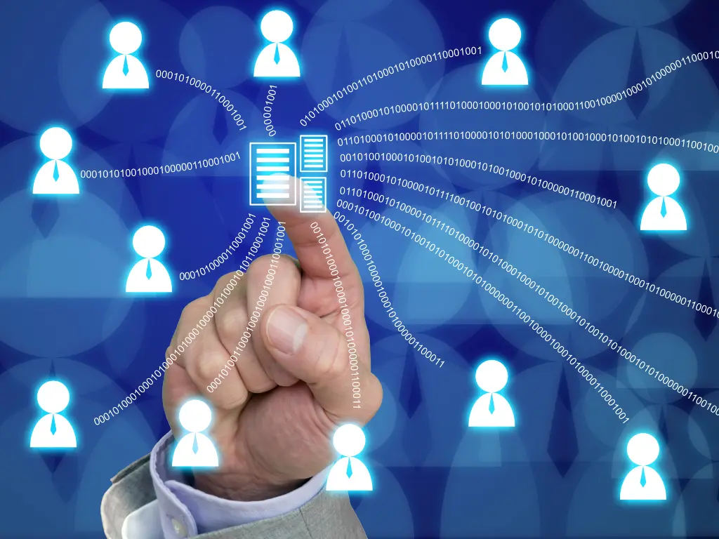 A hand touches a digital icon with lines connecting to multiple avatar icons, symbolizing data sharing or network communication on a blue background.